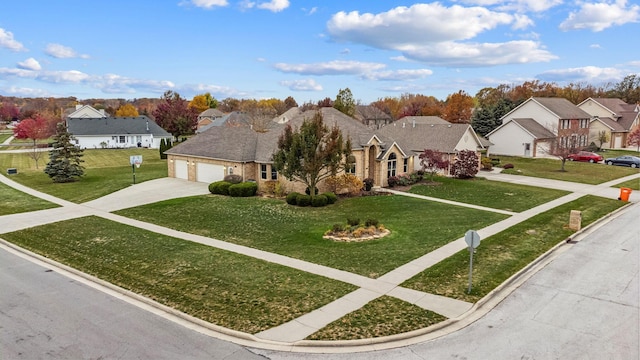 view of front of property with a front lawn and a garage