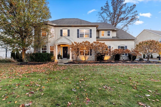 view of front facade featuring a front yard