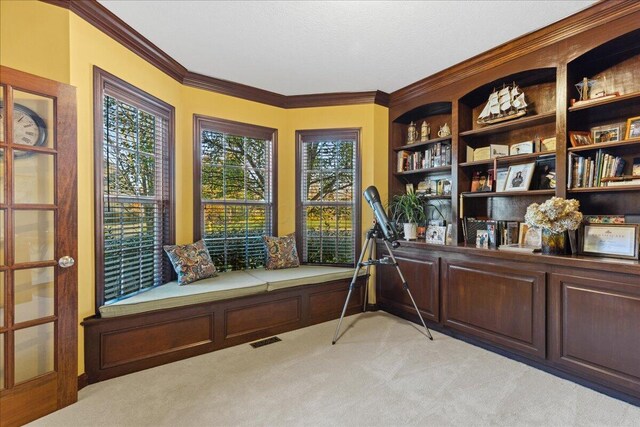 living area featuring light carpet and crown molding