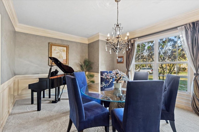 carpeted dining room featuring ornamental molding and a notable chandelier