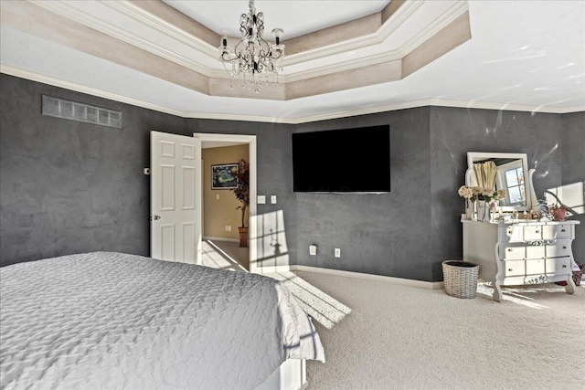 bedroom featuring carpet flooring, a raised ceiling, ornamental molding, and an inviting chandelier