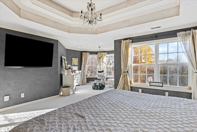 unfurnished bedroom featuring a raised ceiling, carpet floors, crown molding, and a chandelier