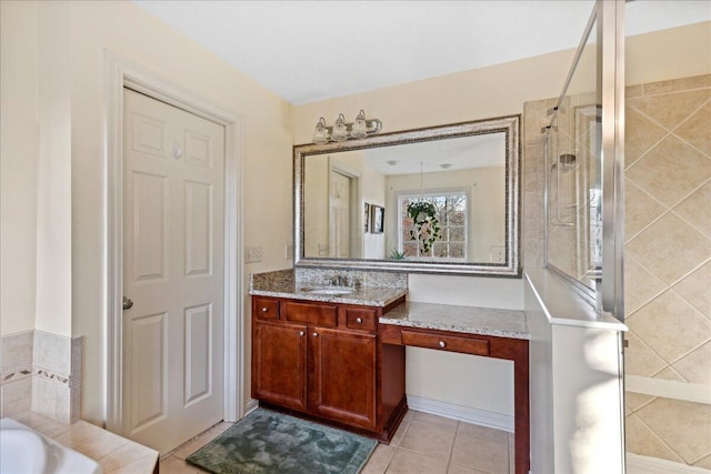 bathroom featuring plus walk in shower, vanity, and tile patterned floors