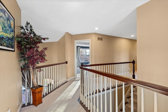 hallway with carpet floors