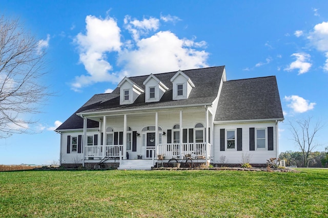 new england style home with a porch and a front yard