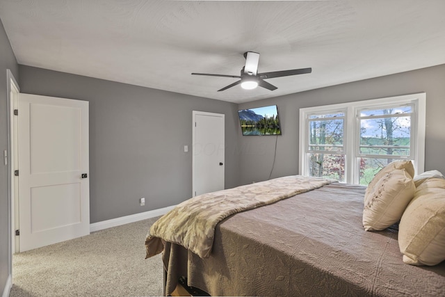 bedroom with ceiling fan and carpet flooring