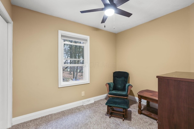 sitting room featuring carpet floors and ceiling fan