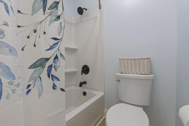 bathroom with shower / tub combo and toilet