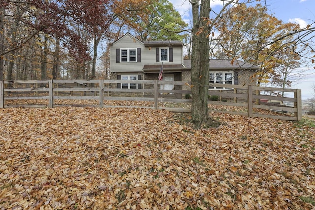 rear view of house with a garage