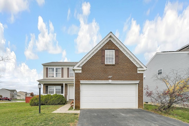 view of property featuring a front lawn and a garage