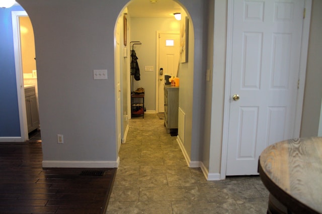 hall with dark hardwood / wood-style flooring