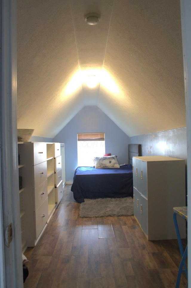 bedroom featuring vaulted ceiling, dark wood-type flooring, and pool table