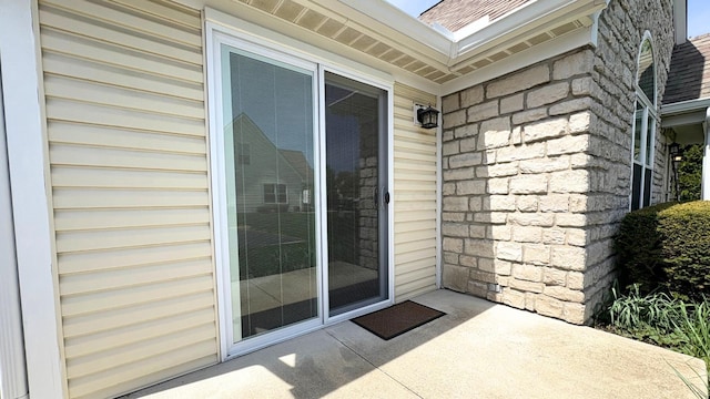7837 Farmsbury Dr, Reynoldsburg, OH 43068 - property entrance featuring roof with shingles and stone siding