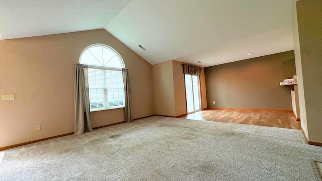 7837 Farmsbury Dr, Reynoldsburg, OH 43068 - empty room with plenty of natural light, baseboards, carpet, and lofted ceiling