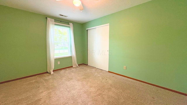 7837 Farmsbury Dr, Reynoldsburg, OH 43068 - unfurnished bedroom featuring light colored carpet, baseboards, visible vents, and a closet