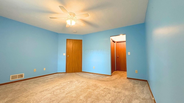 7837 Farmsbury Dr, Reynoldsburg, OH 43068 - unfurnished bedroom with carpet floors, a textured ceiling, a ceiling fan, baseboards, and visible vents