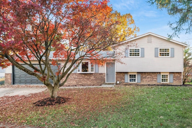 split level home with a front lawn