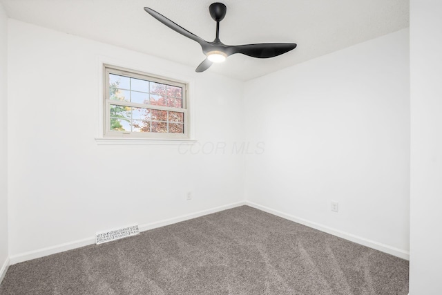 carpeted empty room featuring ceiling fan