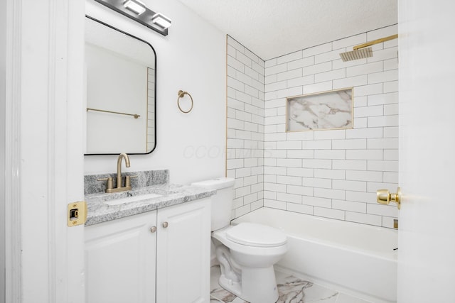 full bathroom featuring vanity, tiled shower / bath combo, a textured ceiling, and toilet