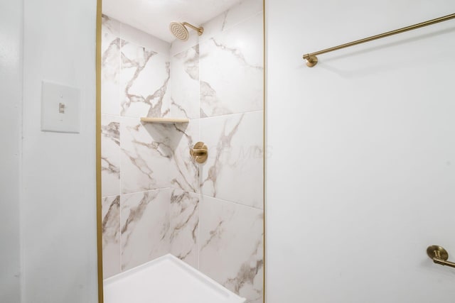 bathroom with tiled shower