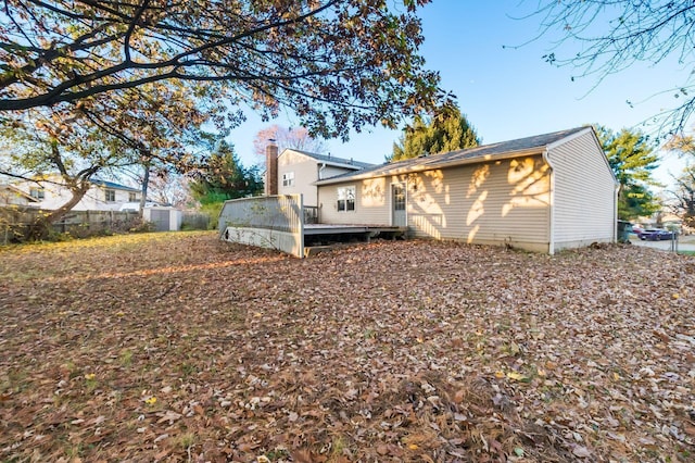 view of property exterior featuring a wooden deck