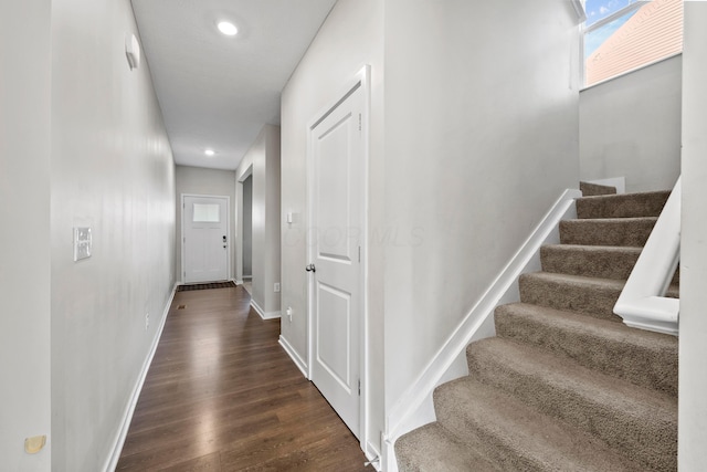 corridor featuring dark wood-type flooring