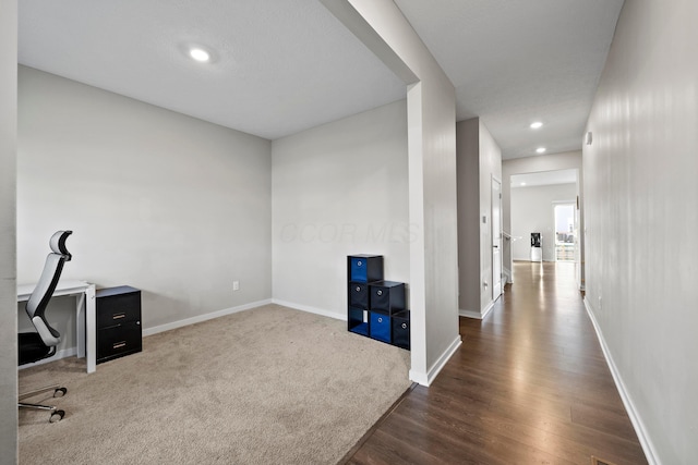 hall with dark hardwood / wood-style flooring