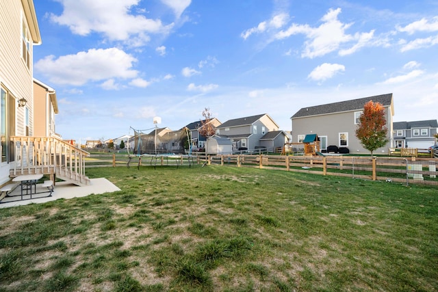 view of yard featuring a trampoline