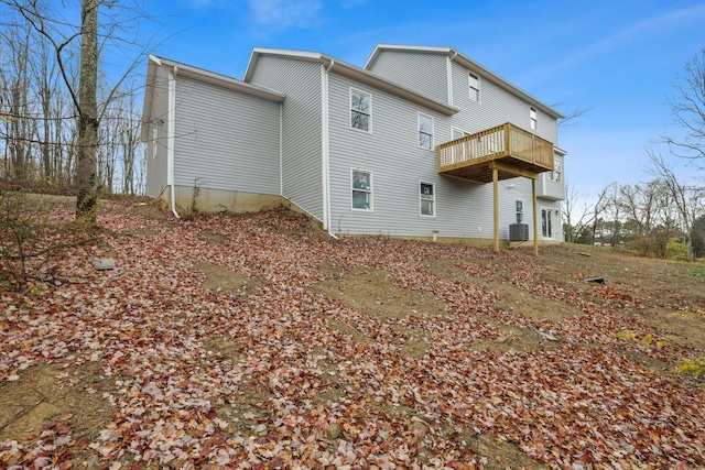 rear view of property featuring central air condition unit