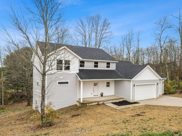 view of front of home featuring covered porch, concrete driveway, roof with shingles, and an attached garage