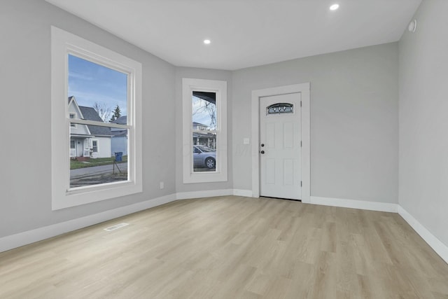 foyer entrance with light hardwood / wood-style flooring