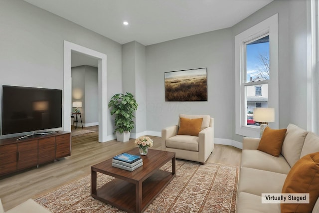 living room with light hardwood / wood-style floors