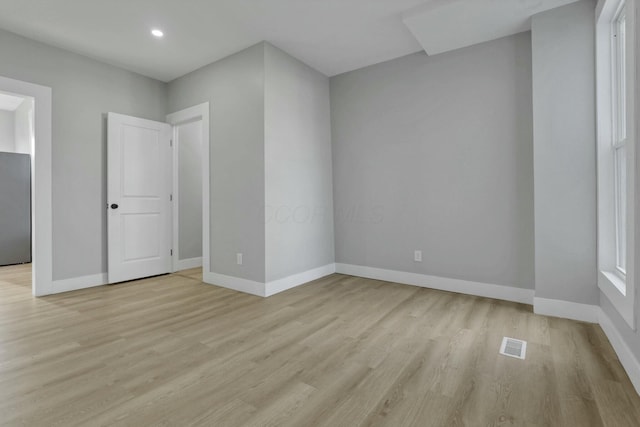 unfurnished room featuring light wood-type flooring