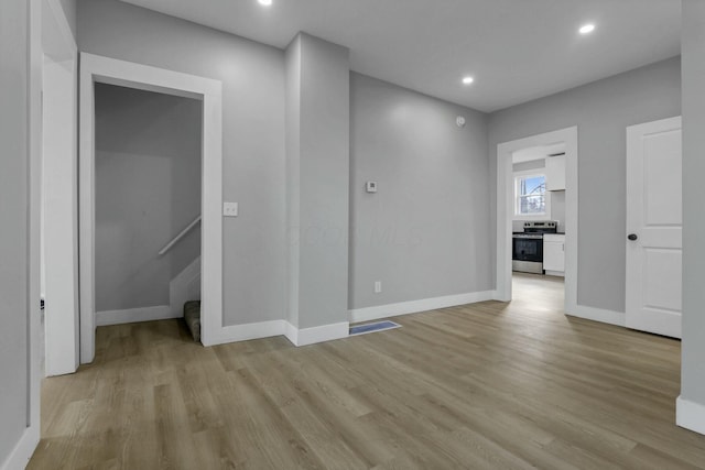 spare room with light wood-type flooring