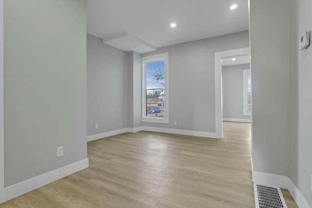 spare room featuring light wood-type flooring