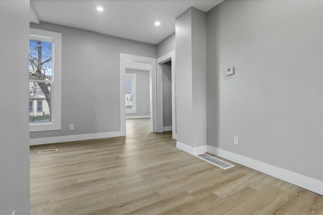 spare room with light wood-type flooring