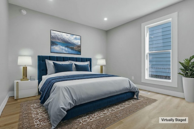 bedroom featuring hardwood / wood-style flooring