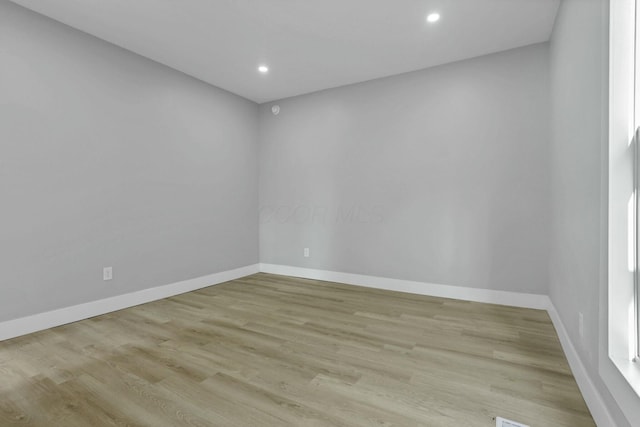 empty room with light wood-type flooring