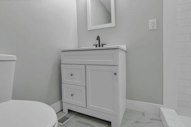 bathroom with vanity and toilet