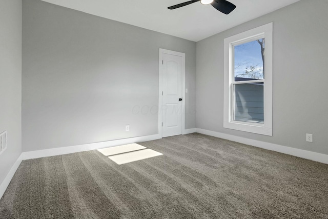 empty room with carpet flooring and ceiling fan