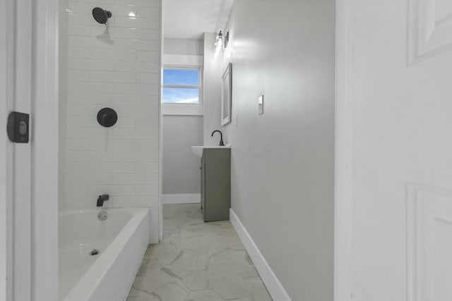 bathroom with vanity and tiled shower / bath combo