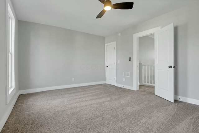 unfurnished bedroom with carpet floors and ceiling fan