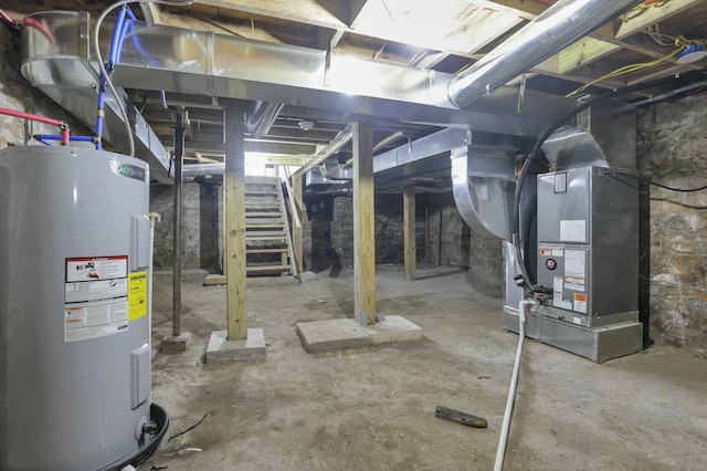 basement with electric water heater and heating unit