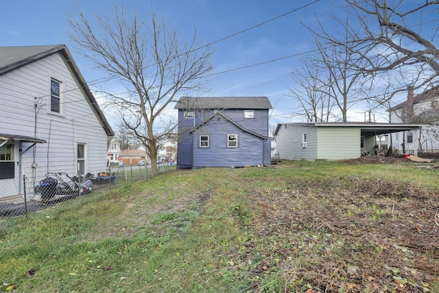 rear view of house with a carport