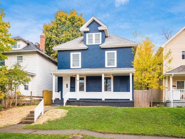 view of property with a porch and a front yard