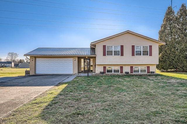 split level home featuring a front yard and a garage