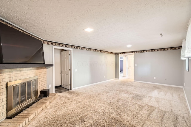 interior space featuring carpet, a textured ceiling, and a brick fireplace