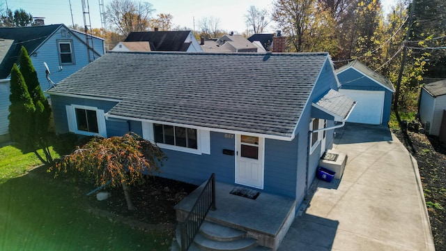 rear view of house featuring a garage