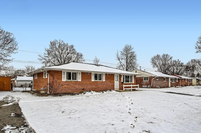 view of front of home featuring brick siding