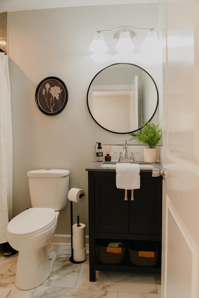317 Johnson St, Columbus, OH 43203 - full bath with vanity, marble look tiles, and a shower with curtain